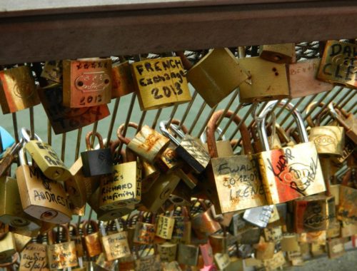 Lock reading "French Exchange 2013" on lock bridge in Paris.