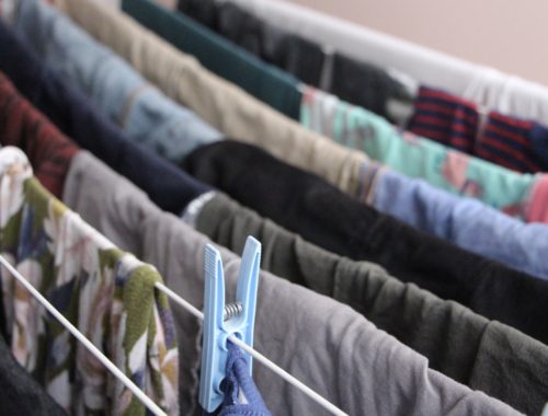 A close-up image of clothes drying on a rack.