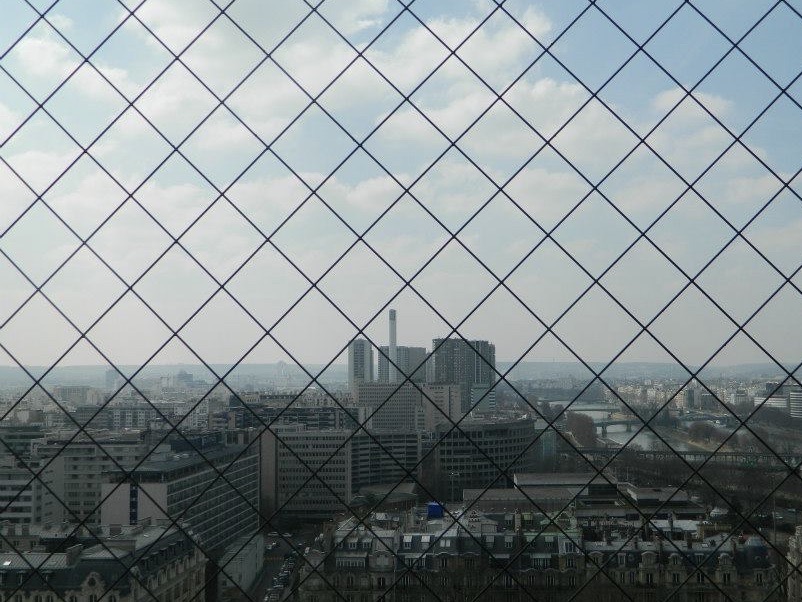 A view through the Eiffel Tower's metal grate.