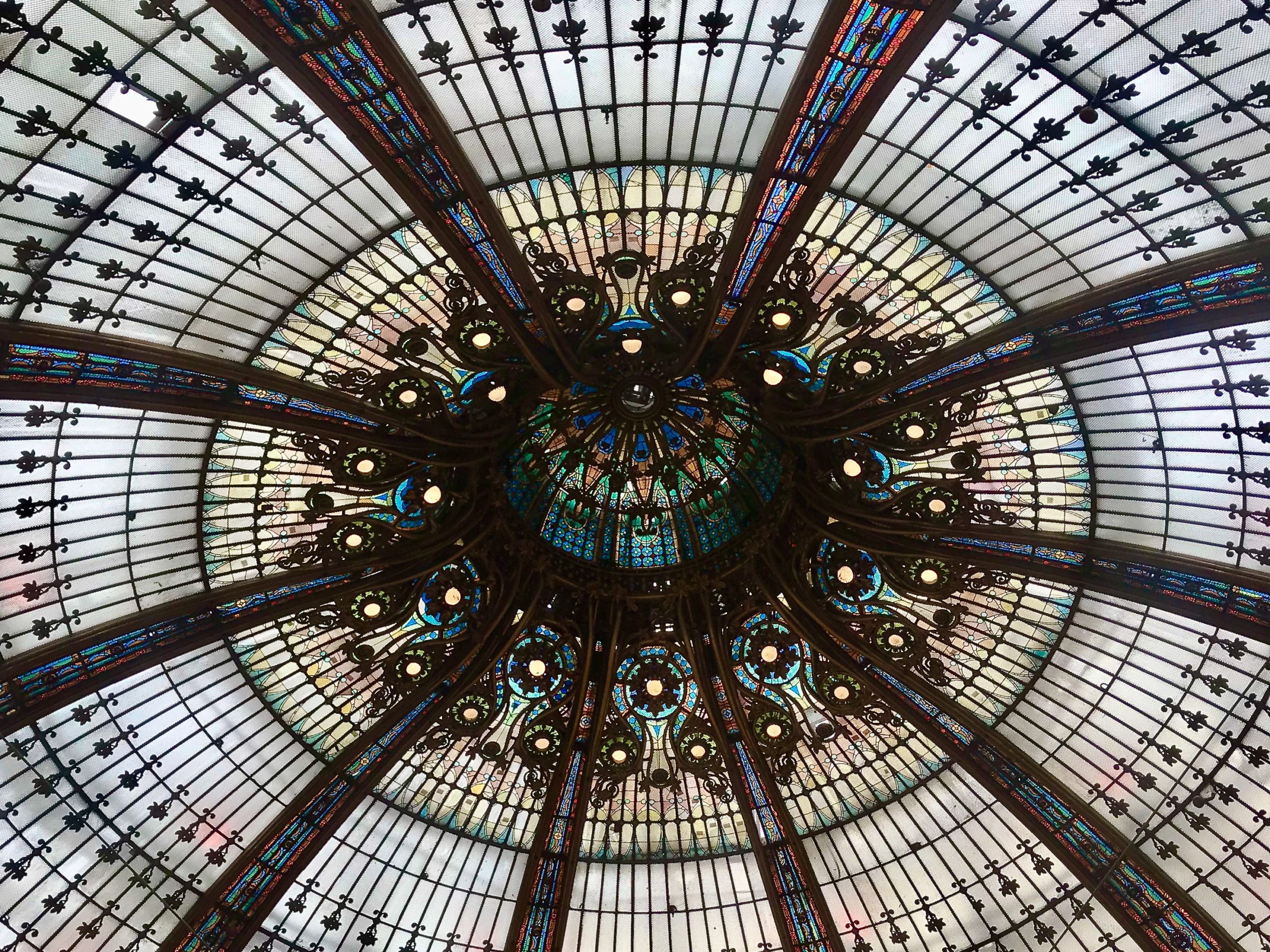 A close-up of the Galeries Lafayette's stained glass ceiling.