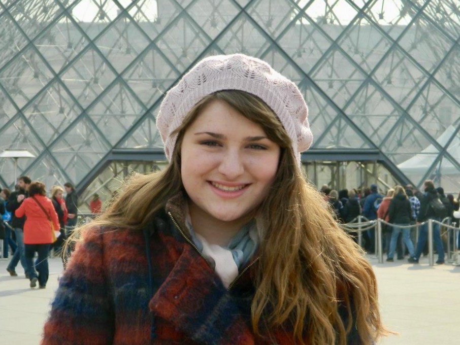 Maria in front of the Louvre Pyramid.