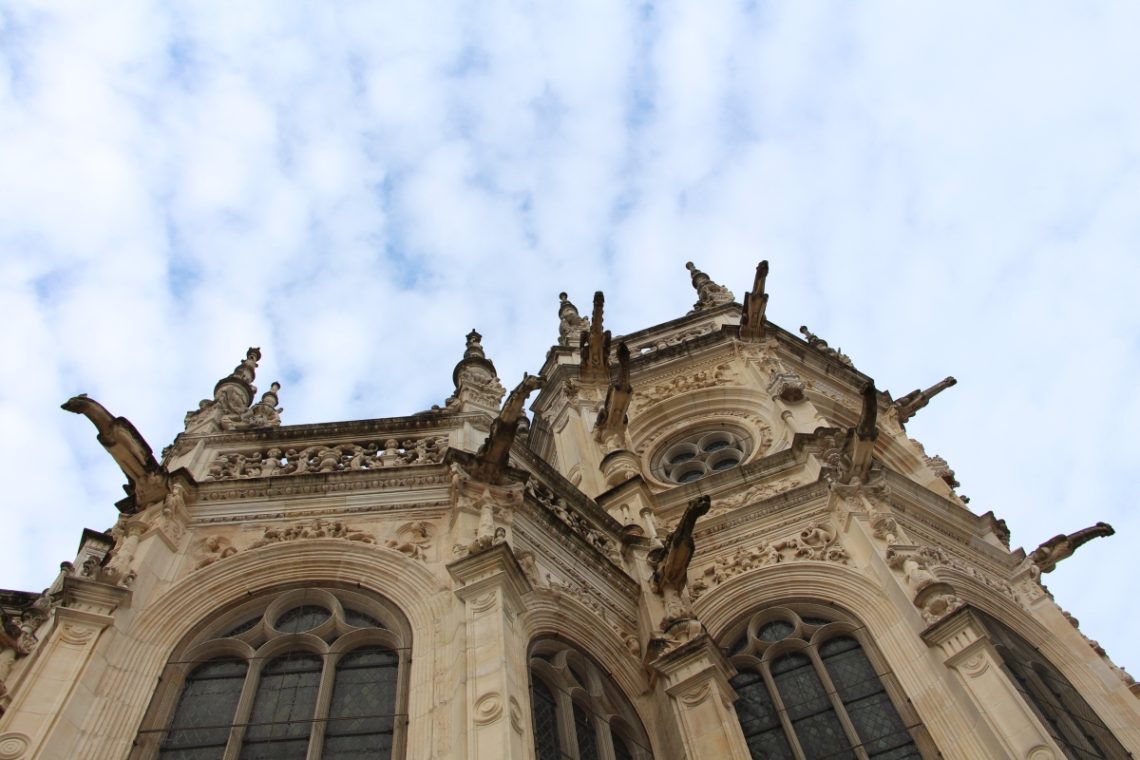 An upward view of a church in Caen.