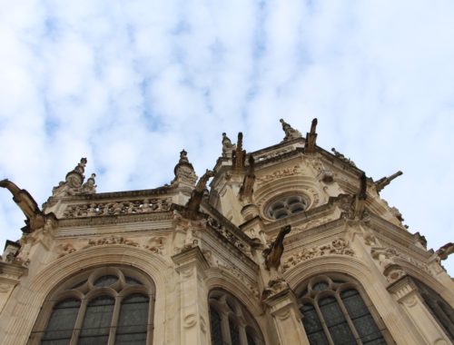 An upward view of a church in Caen.