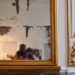 Jalen and Maria, blurred in a selfie in an antique mirror.