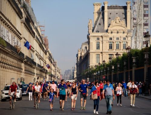 A crowd walking on Rue de Rivoli celebrating France's World Cup Win.