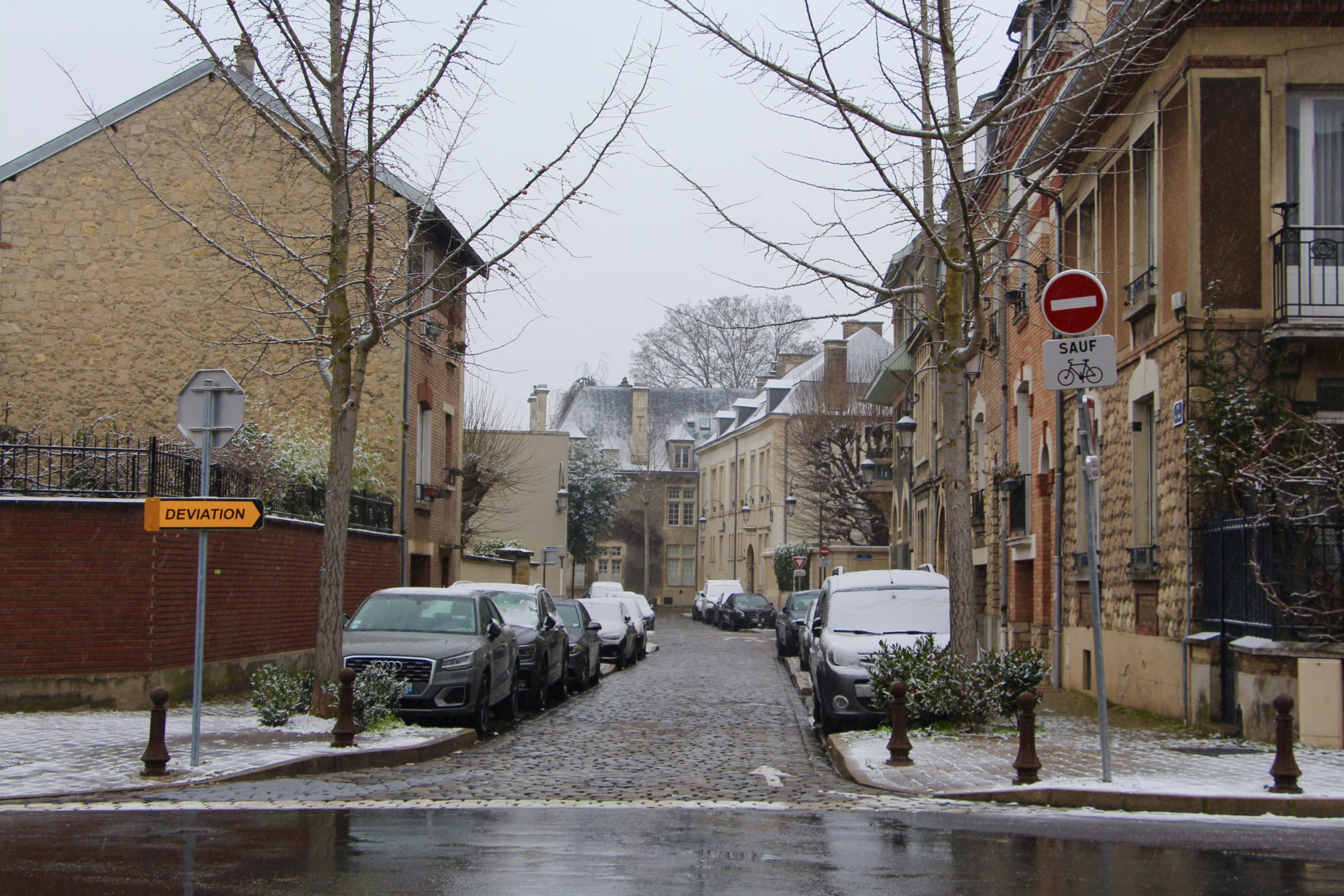 A street in Reims, France with a light dusting of snow.