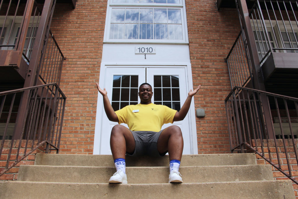 Jalen in front of an Apartment building at the University of Mary Washington.
