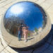 Jalen and Maria pose for a selfie in a reflective hemisphere in Nancy, France.