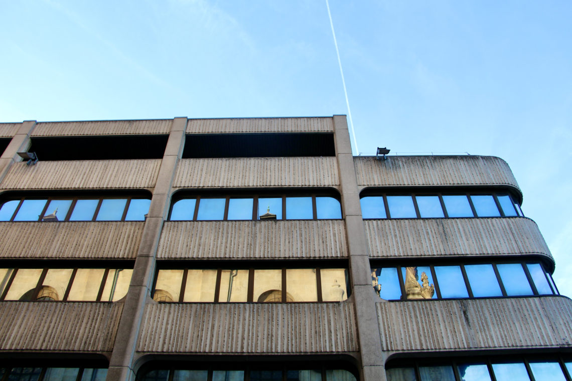 A building with reflective windows in Nancy, France.