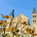 Yellow flowers in front of the Saint Remi Basilica in Reims, France.