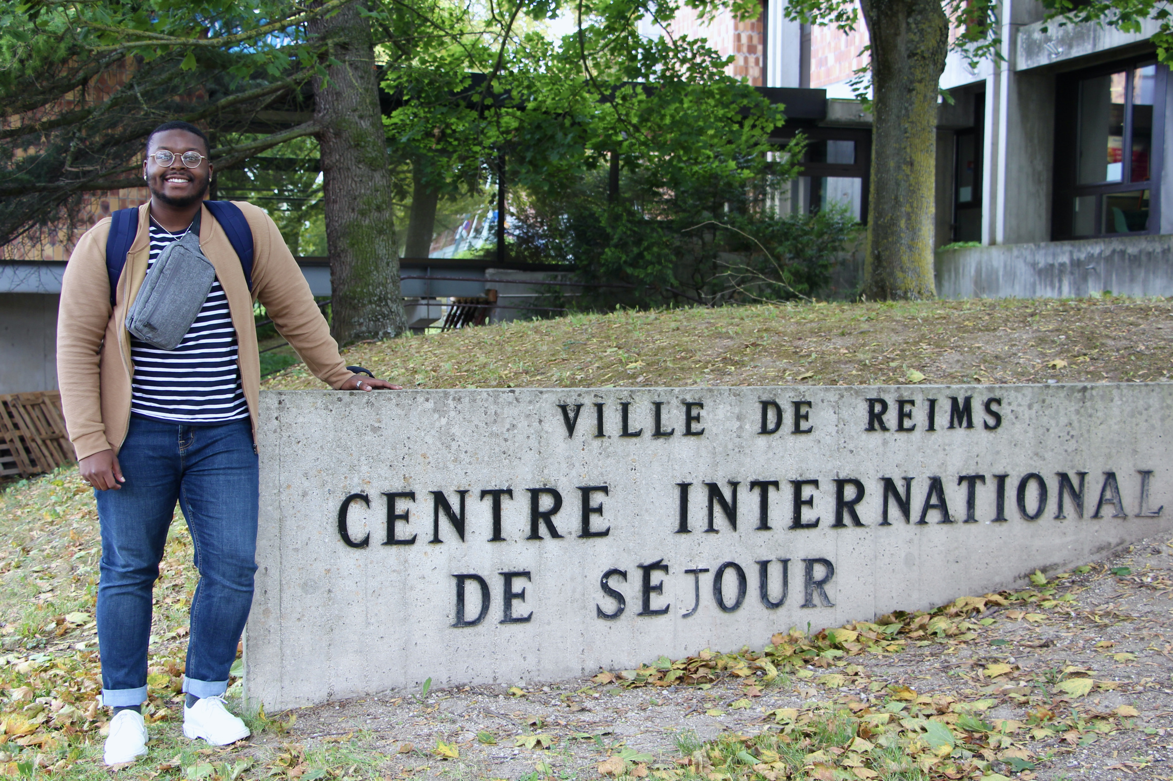 Jalen poses at the CIS in Reims, France wearing a striped shirt.