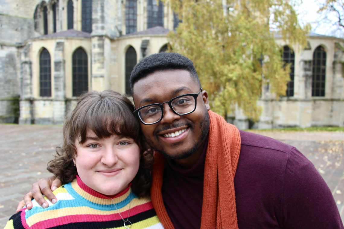 Maria and Jalen smiling by the Basilica in Reims, France.