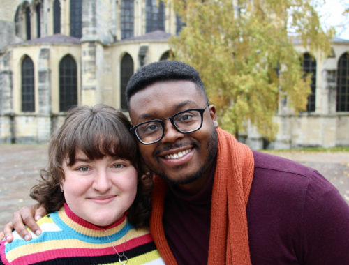 Maria and Jalen smiling by the Basilica in Reims, France.