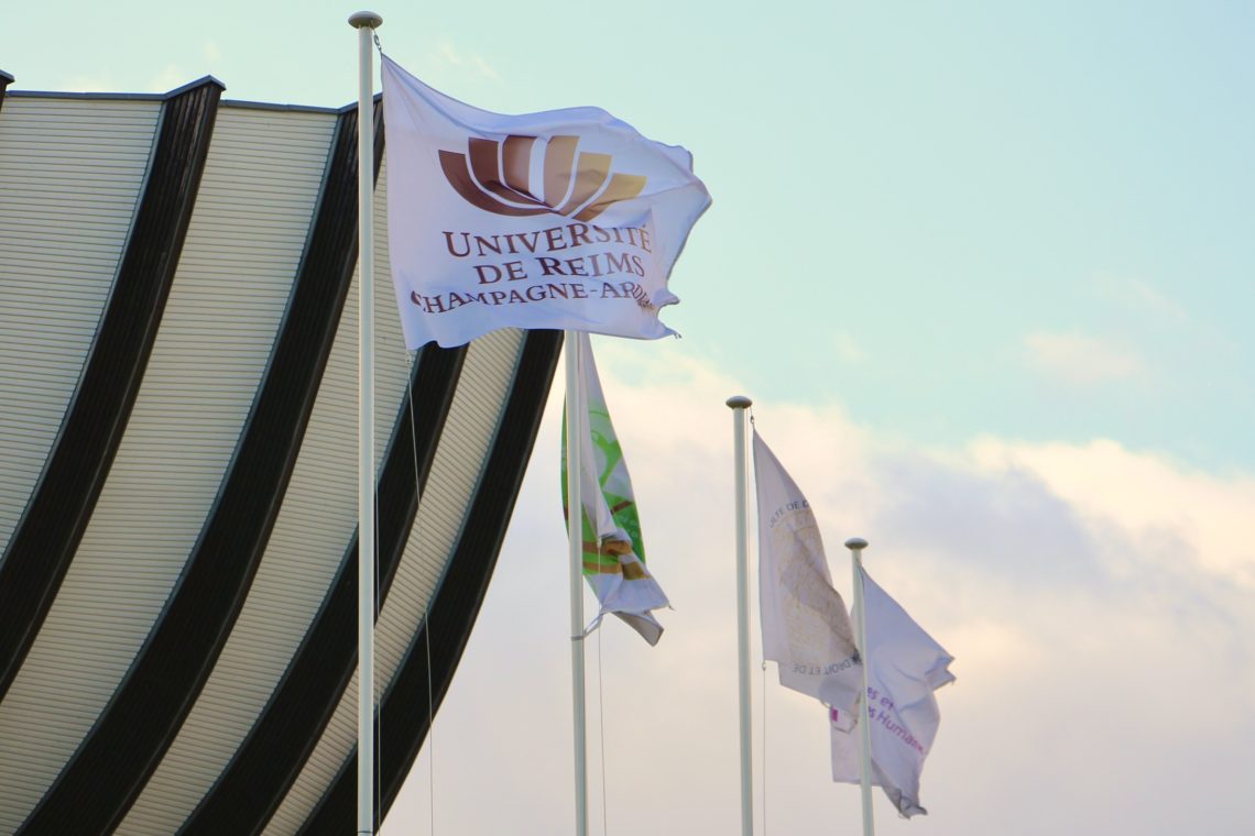 The flags at the entrance of the Université de Reims Champagne-Ardenne.