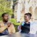 Jalen and Maria enjoy frozen drinks in front of the Cathédrale de Reims.