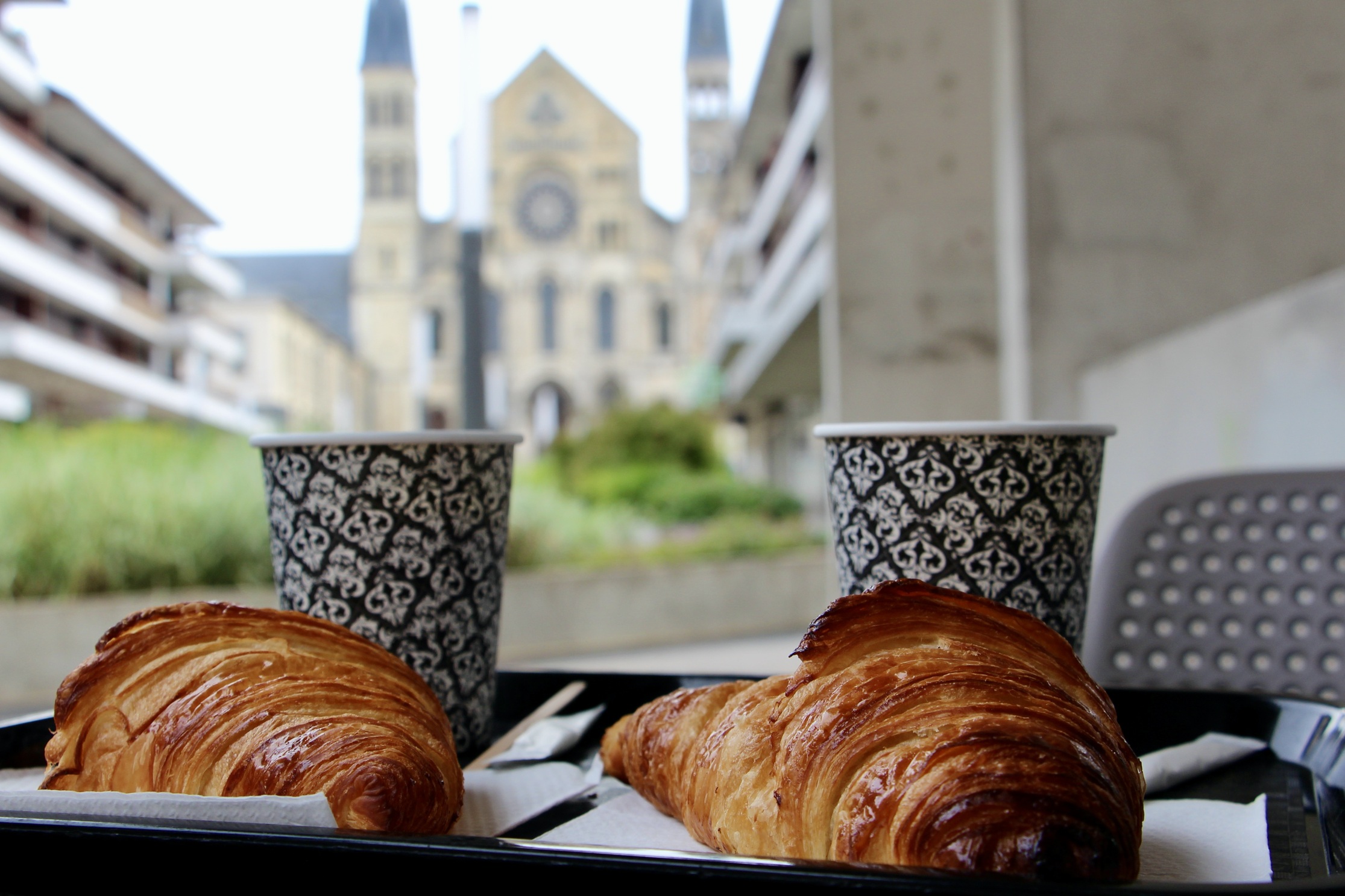 Two croissants and two cappuccinos.