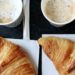 Two croissants and two cappuccinos.