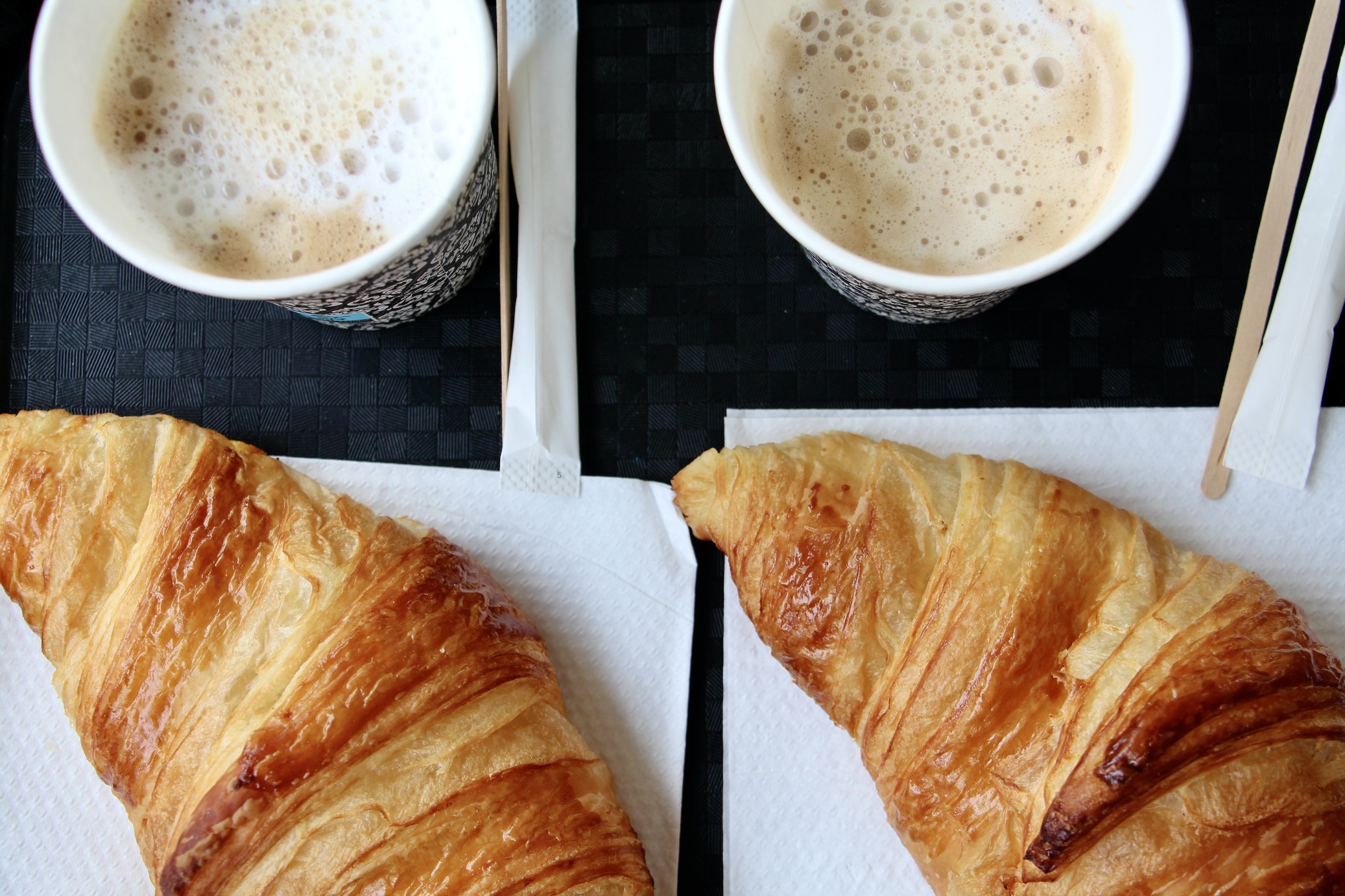 Two croissants and two cappuccinos.