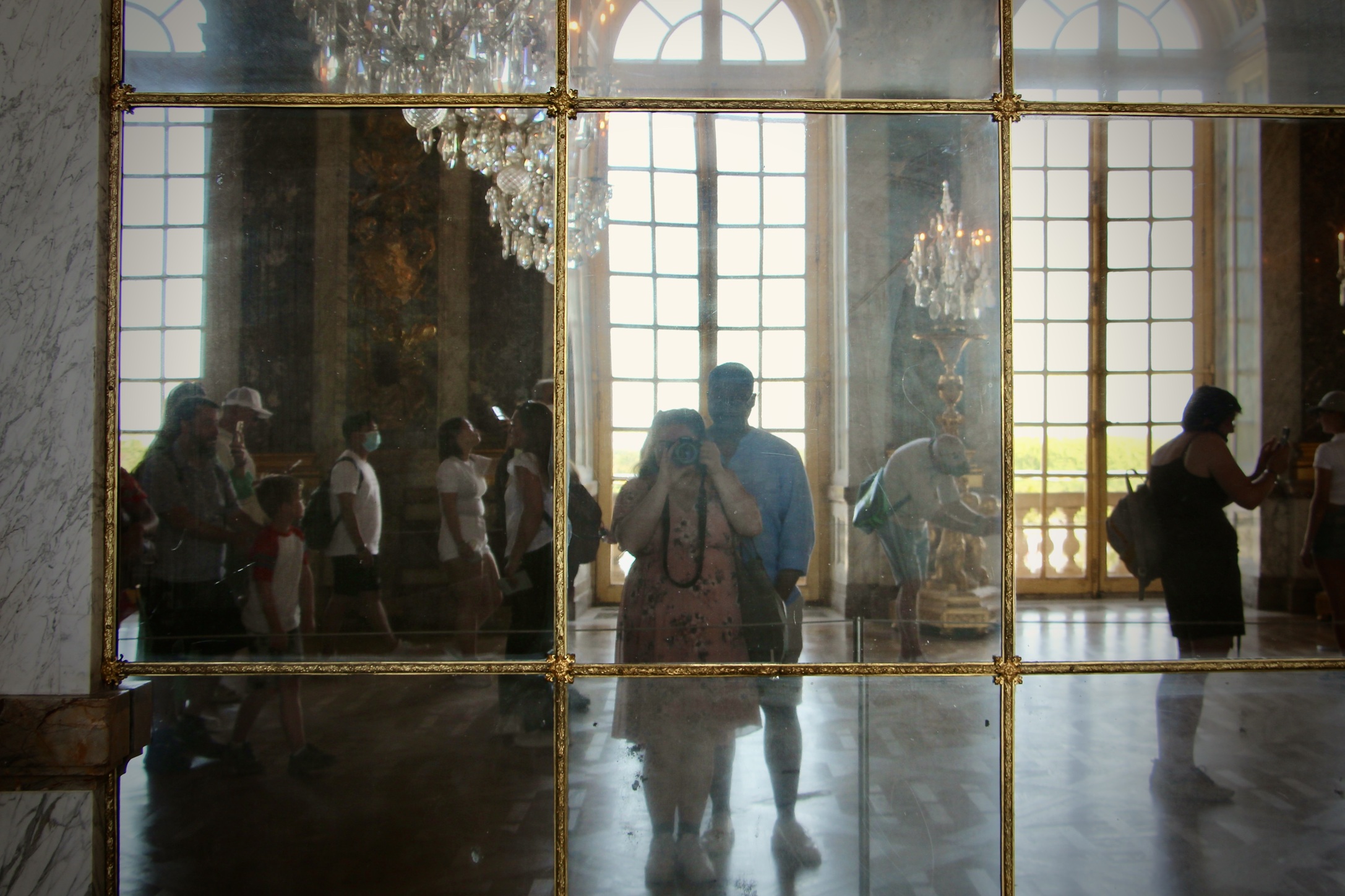 Jalen and Maria pose for a selfie in the Hall of Mirrors in the Palace of Versailles.
