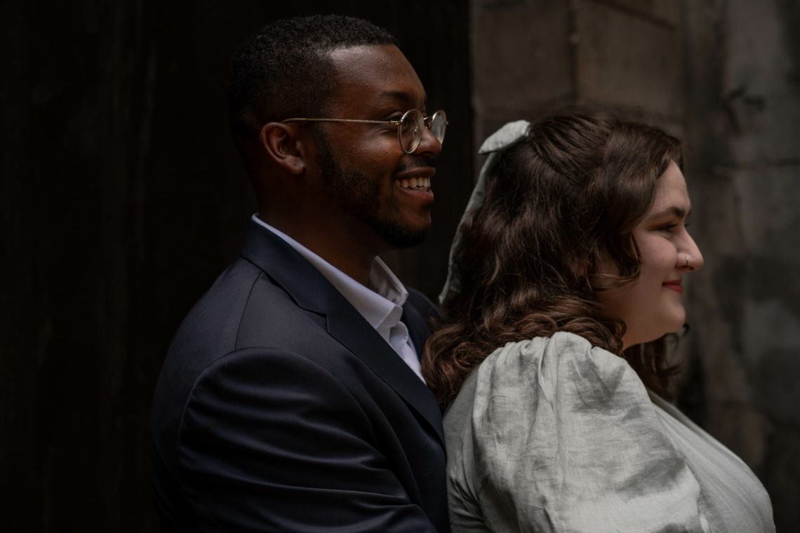 Jalen laughs and hugs Maria after their wedding.