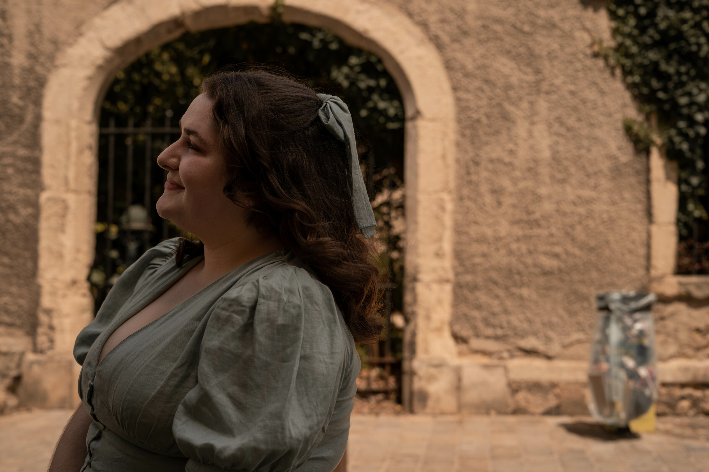 Maria smiles outside of the Jardin du Musée Le Vergeur.