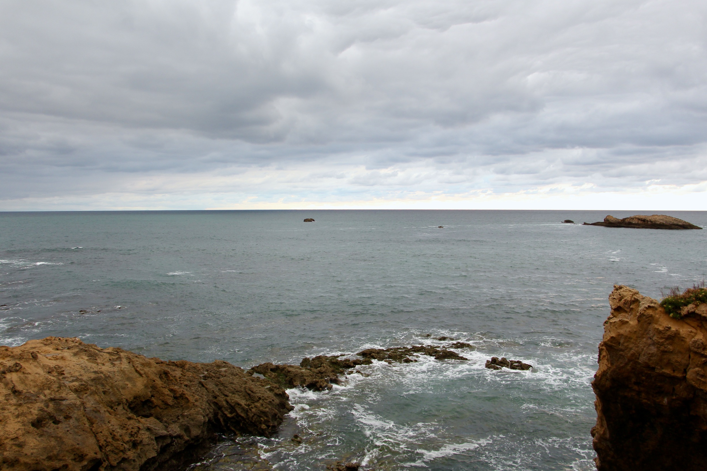 A view of the sea with an overcast sky in Biarritz, France.