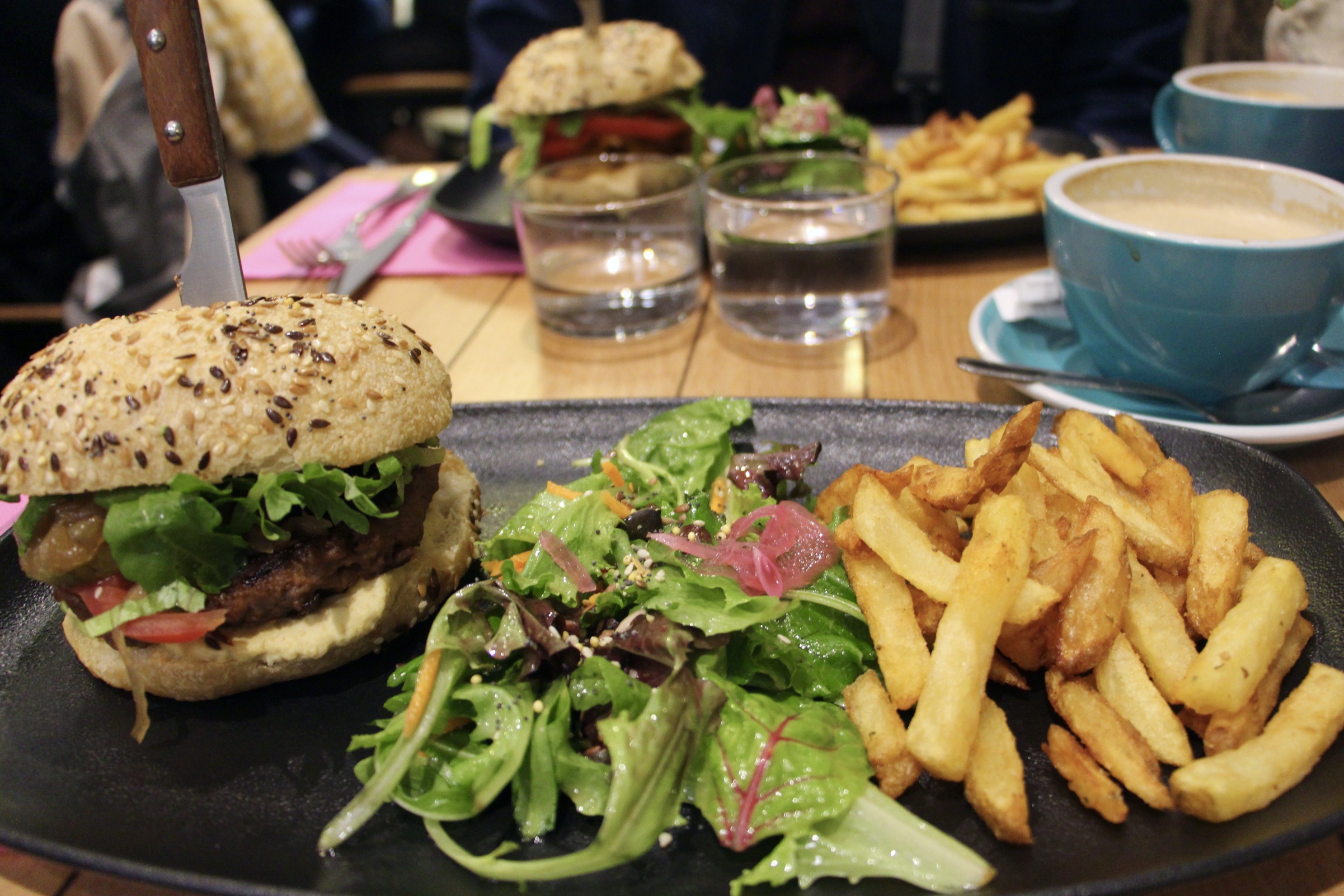 Milwaukee Café's Beyond Burger with a side salad and fries in Biarritz, France.
