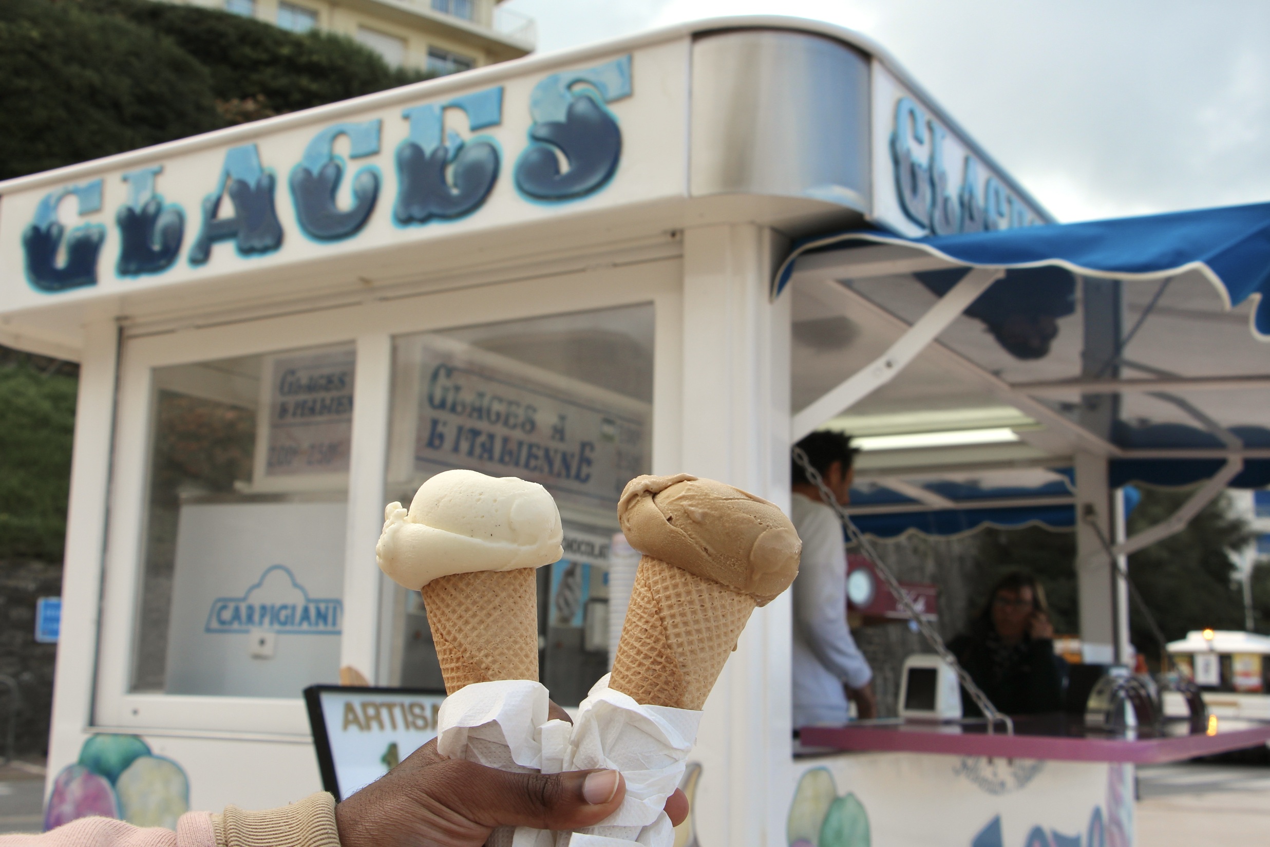 A vanilla ice cream cone and a coffee ice cream cone in Biarritz, France.