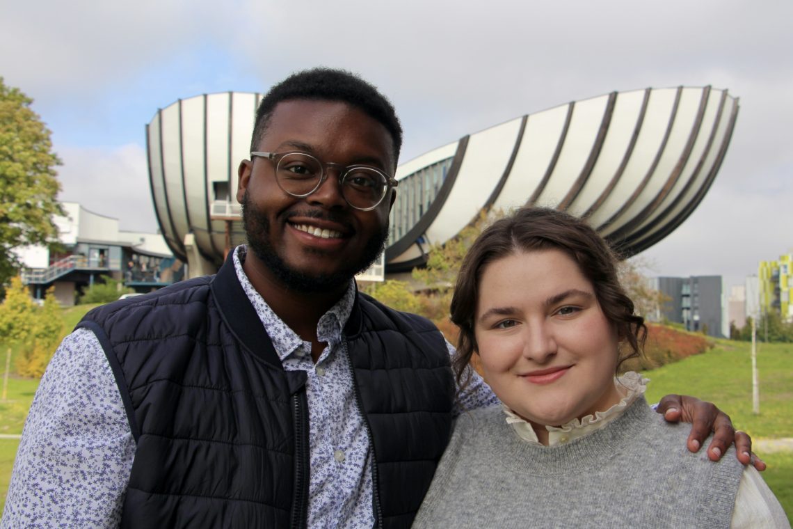 Jalen and Maria smiling on URCA's campus.