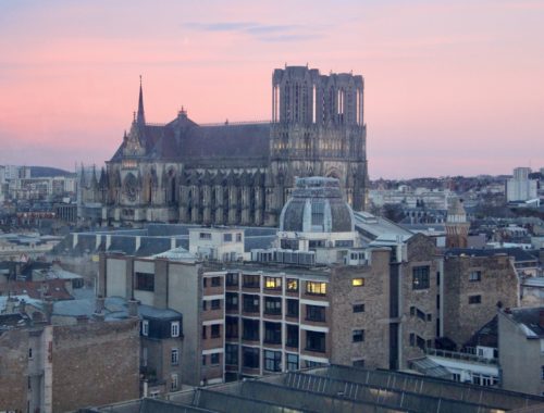 An aerial view of Reims, France including the Cathédrale Notre-Dame de Reims.