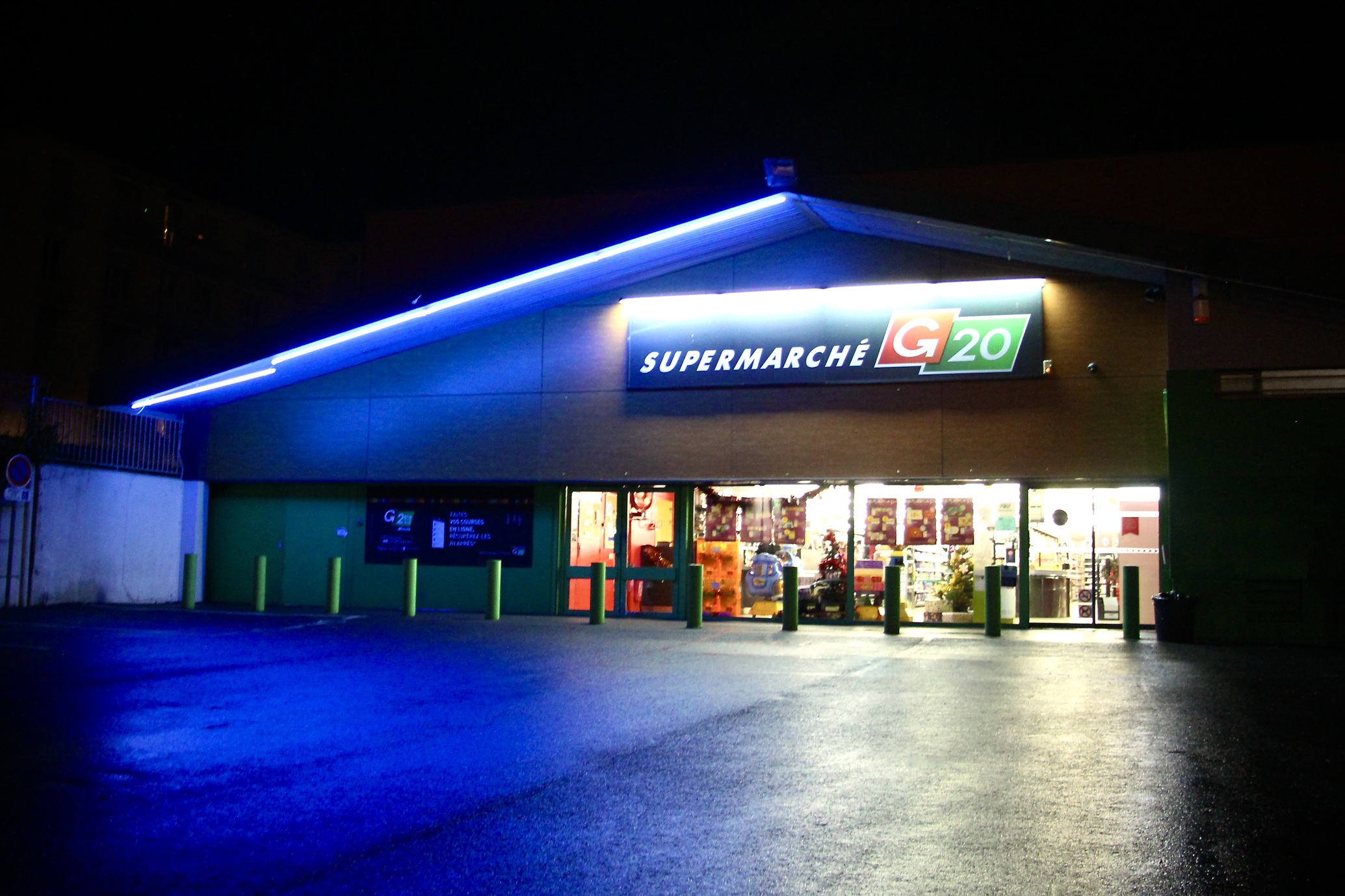 A nighttime view of a G20 grocery store in Reims, France.