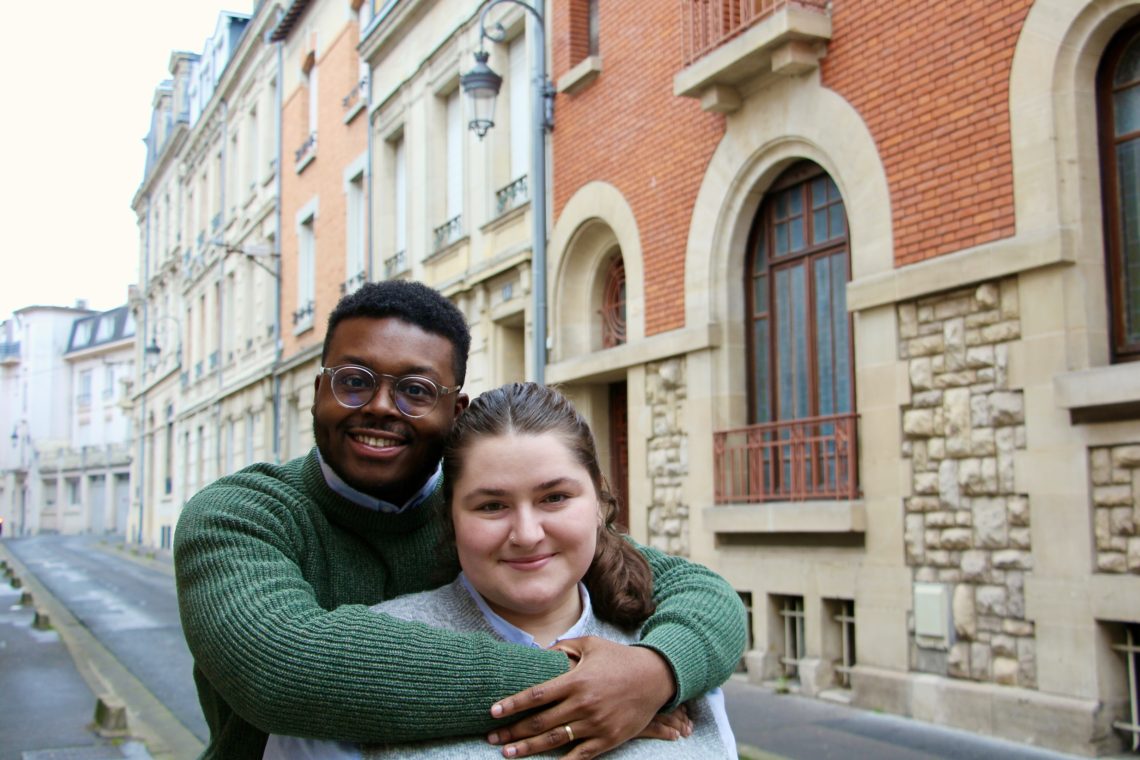 Jalen hugs Maria on Rue des Jacobins in Reims, France.