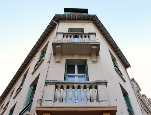 A corner view of an apartment building in Reims, France.