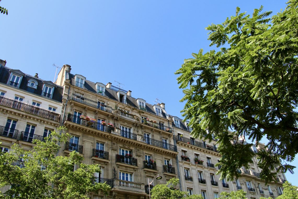 Parisian buildings against a clear, blue, summer sky in Paris, France.